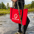 Load image into Gallery viewer, A woman in a river holding a Sauce Toss Go
