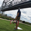 Load image into Gallery viewer, A man under a bridge holding a Sauce Toss Net