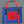 Load image into Gallery viewer, A Blue and Red Sauce Toss Travel Bag on a grey background
