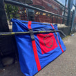 Load image into Gallery viewer, A Sauce Toss Travel Bag at and outdoor restaurant patio