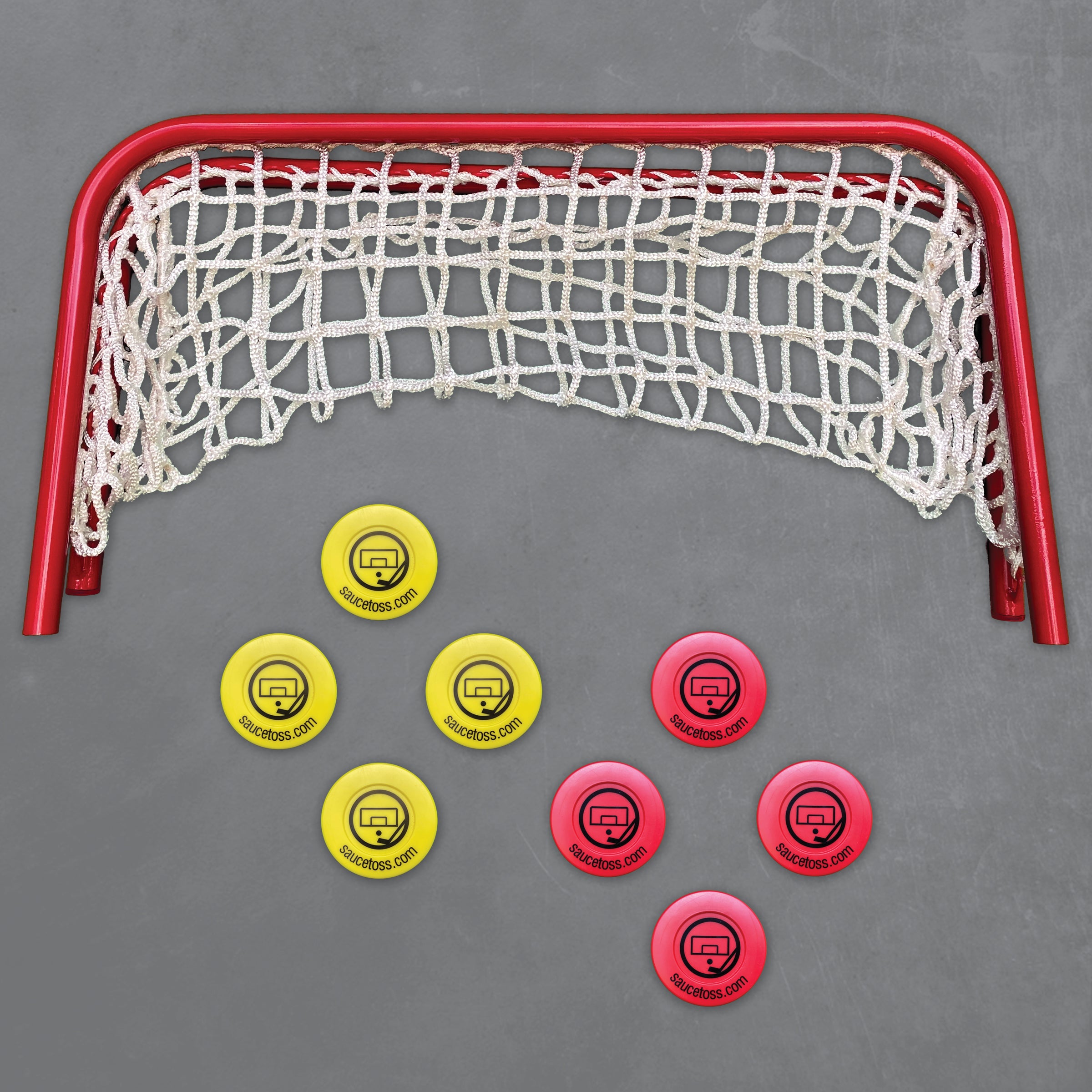 Pucks and net on grey background
