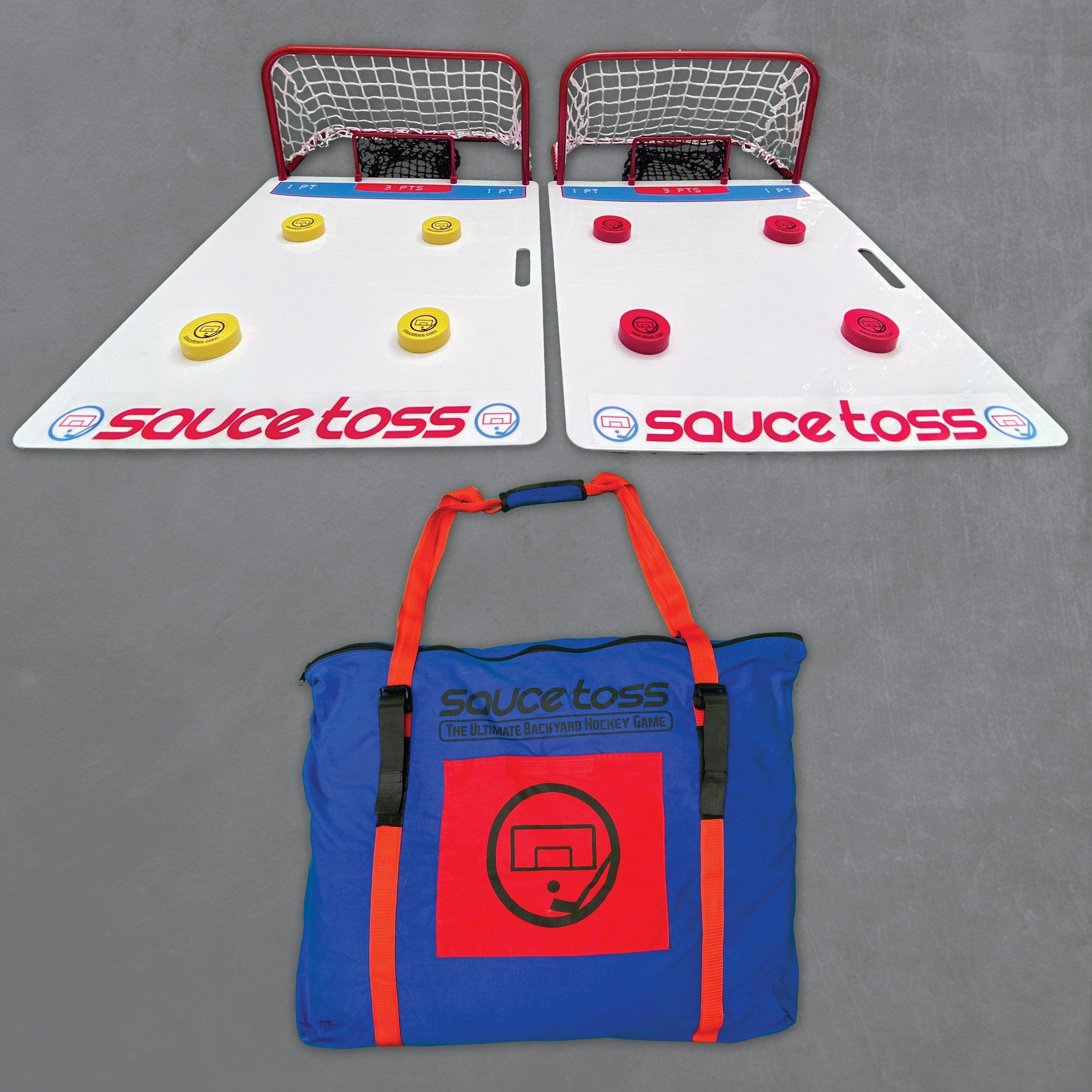 Two Sauce Toss Board, Nets, Pucks and a carrying bag on a grey background